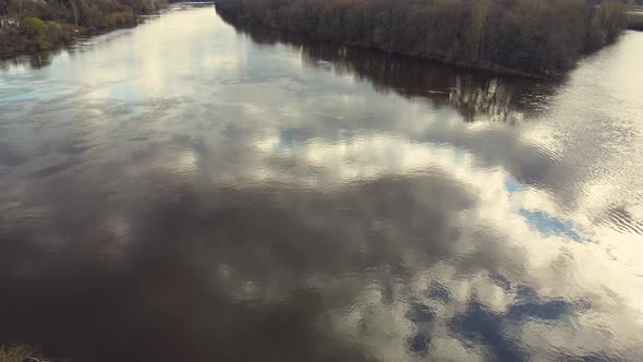 Blue Sky with Clouds Beautifully Reflected in the River Spring Flood