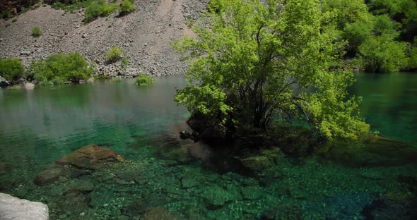 Small Mountain Lake of  blue color Urungach. Located in Uzbekistan, Central Asia. 1 out of 10
