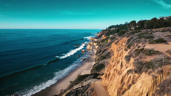 Deserted Wild El Matador Beach Malibu California Aerial Ocean View - Waves with Rocks