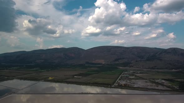 Alykes the Hellenic saltworks located outside of Mesolongi in Greece. Drone footage with the clouds