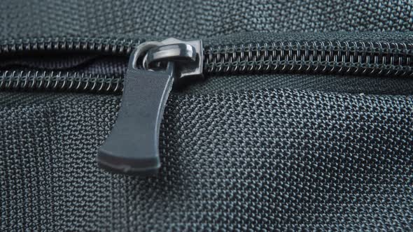 Close up zipper lock of green backpack