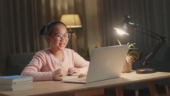 Teenage Girl Learning Online From Laptop