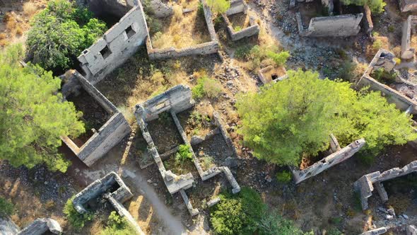aerial drone top down view of abandoned ruins from the famous ghost village of Kayakoy in Fethiye Tu