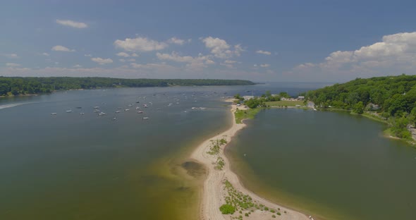 Flying Towards Cold Spring Beach and Boats Anchored on Harbor in Long Island