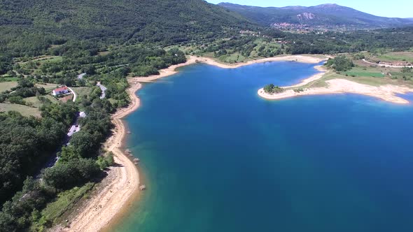 Flying above beautiful landscape of artificial lake of Peruca, Croatia