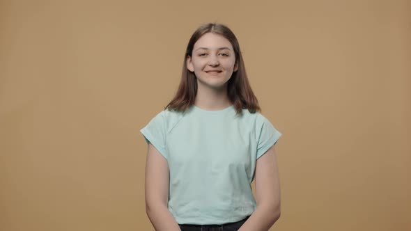 Portrait of Charming Beauty Model Looking at Camera and Smiling