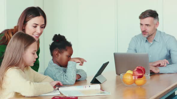 Cheerful multinational family doing their thing