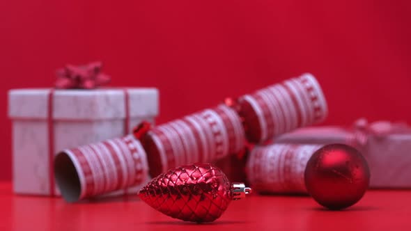 Christmas decorations spinning beside crackers and presents