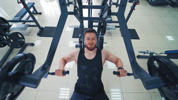 Handsome bodybuilder engaged at fitness club.