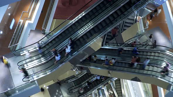 Escalators In Big Modern Shopping Mall. Consumption Concept. 