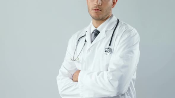 Smiling doctor standing with his hands crossed 4K 4k