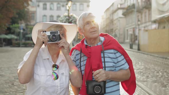 Senior Male and Female Tourists Makes a Photo While Traveling in Lviv, Ukraine