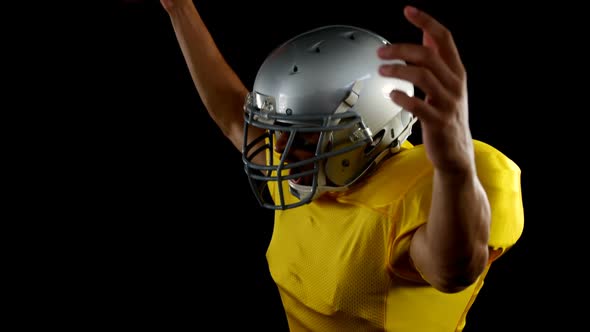 American football player cheering with ball in his hand 4k