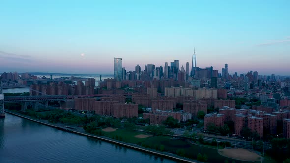 Aerial view on Downtown with Full moon at sunrise