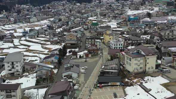 aerial top down of a ski town in nagano japan with empty roads during winter