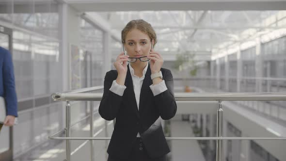 Business Lady Standing in Office Corridor