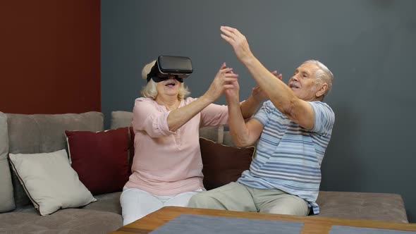 Grandfather and Grandmother with VR Headset Helmet Play Games, Watch Virtual Reality 3D 360 Video