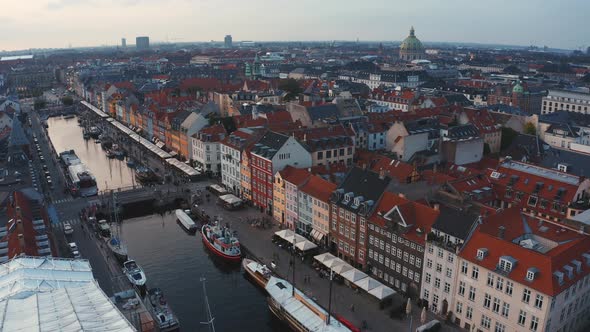 Famous Nyhavn Pier with Colorful Buildings and Boats in Copenhagen Denmark