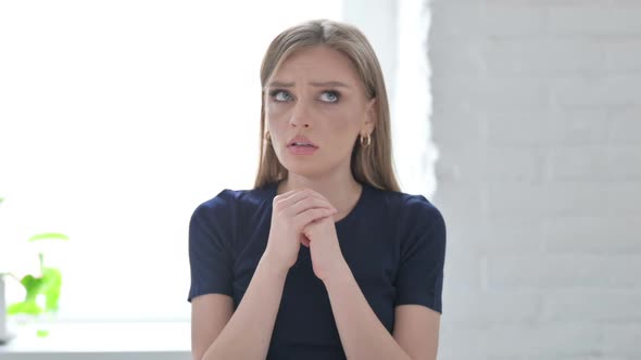 Frightened Woman Looking Around in Fear