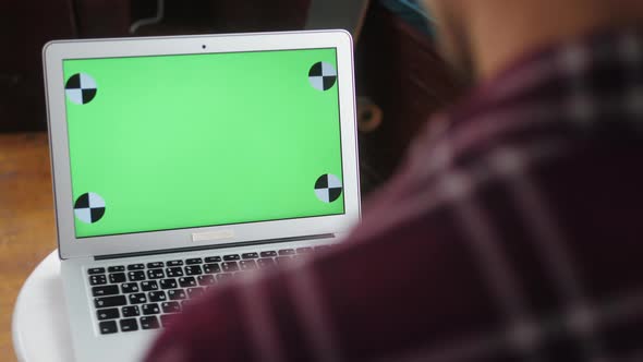 Closeup of Hipster Freelancer Male Hands Using Green Screen Chroma Key Laptop Typing Working in
