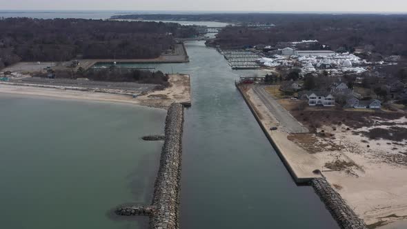 An aerial view over the Shinnecock Canal in Hampton Bays, Long Island, NY. The drone camera dolly in