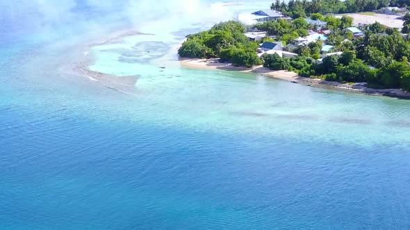 Aerial drone scenery of lagoon beach break by blue sea with sand background