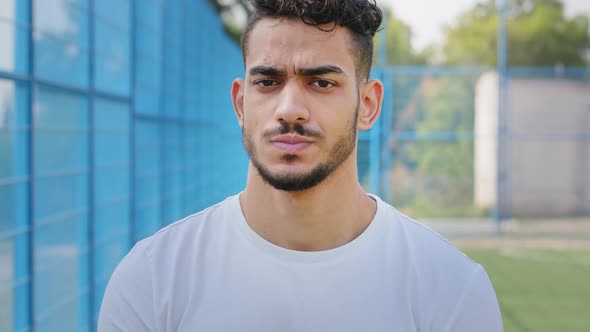 Portrait Angry Disgruntled Young Middle Eastern Indian Student in Summer Sportswear