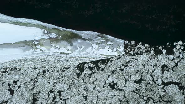 Aerial Top Down View Of Two Rivers Confluence Point In Winter Time