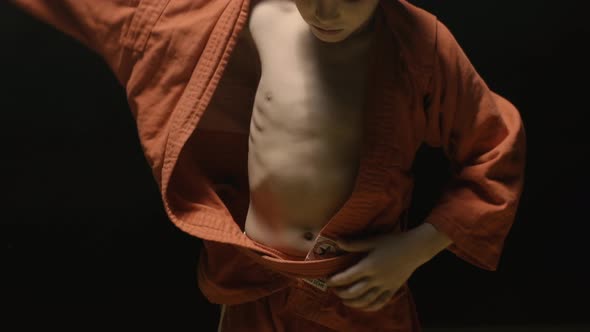 Sportsman Boy In A Red Kimono For Judo
