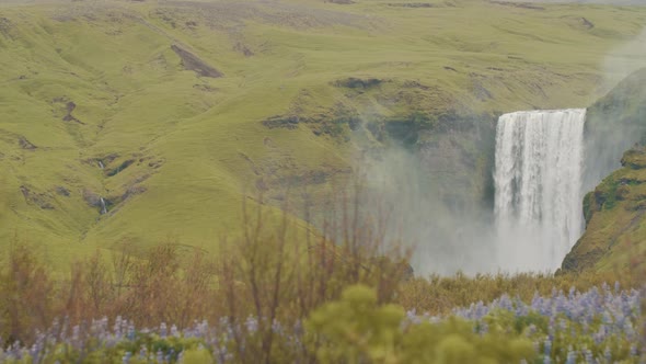 Slow motion shot of the majestic Skogafoss waterfall, an iconic destination of Iceland