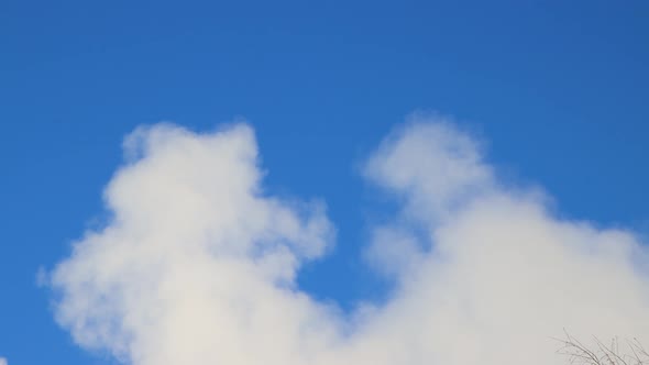 White Cumulus Clouds Against a Blue Sky Like the Smoke From a Tube