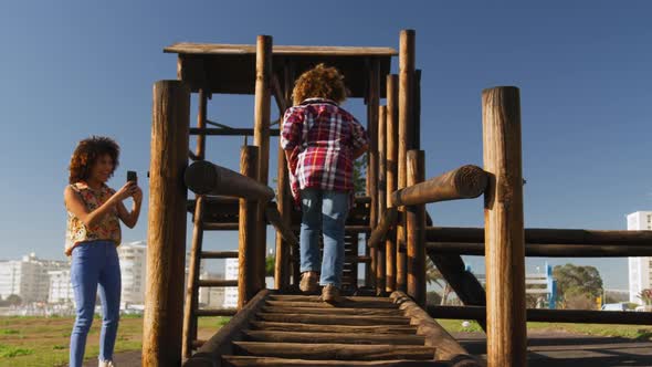 Mother and son having fun at playground