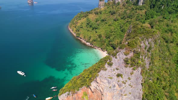 aerial view of a tall limestone mountain cliff at Ko Kai (Chicken Head Island) with a view of the tu