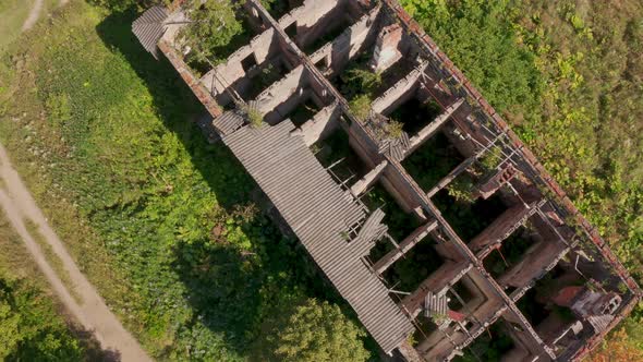 Aerial View of Abandoned and Destroyed Buildings From the Times of the USSR in a Green Picturesque