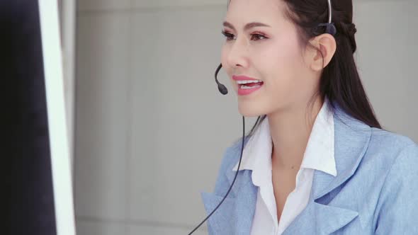 Customer Support Agent or Call Center with Headset Talking to Customer on Phone