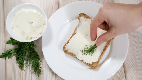 Woman Makes Vegetarian Toast with Soy Cheese