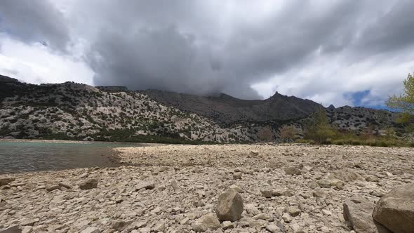 A beautiful timelapse shot of a mountains that clouds overwhelm. Cuber, Mallorca Island, Spain 4K