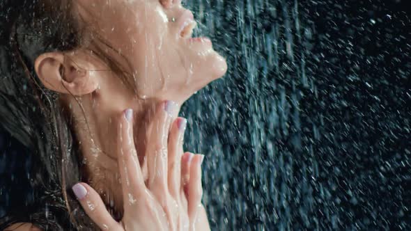 Close Up Face of Sexy Young Woman Dancing Under Water Drops Stream