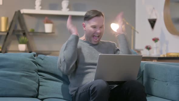 Casual Man with Laptop Feeling Angry on Sofa