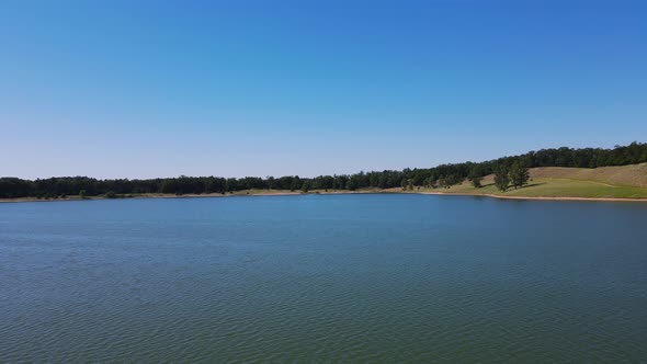 Panning from lake view to show ab island of birds.