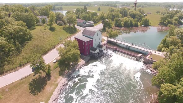 Aerial shot of a mill and river dam