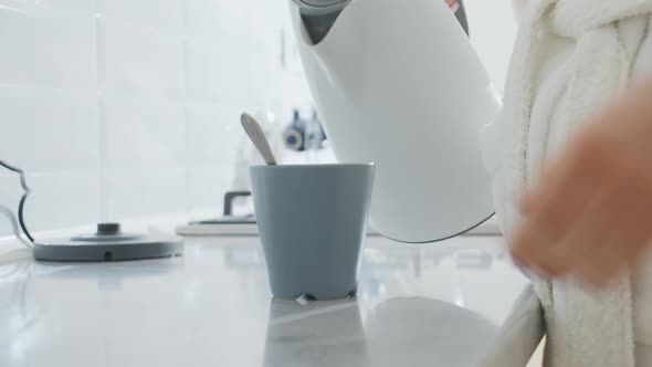 Close Up of Woman Making Coffee on Kitchen