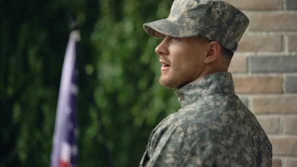 Happy Soldier Glad to Return Back Home, Standing on Backyard of House, Rain