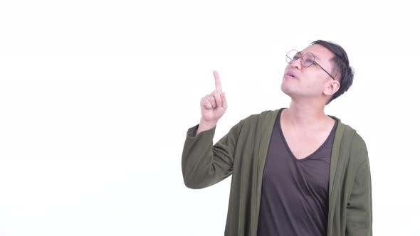 Stressed Japanese Man with Eyeglasses Pointing Up