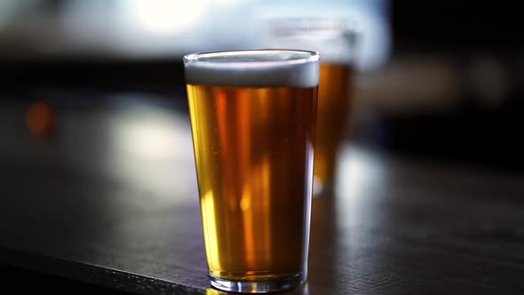 close up pint of beer with rising bubbles