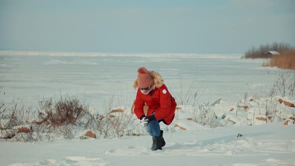 Winter Fun And Leisure Vacation In Weekend Adventure Trip. Woman In Red Parka Jacket.