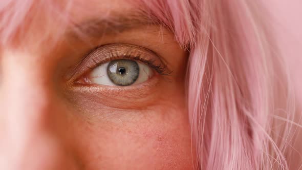 Closeup of Human Female Eye with Pink Hair