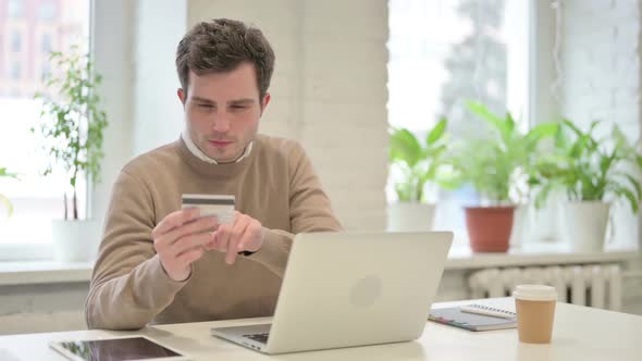 Man Making Successful Online Payment on Laptop