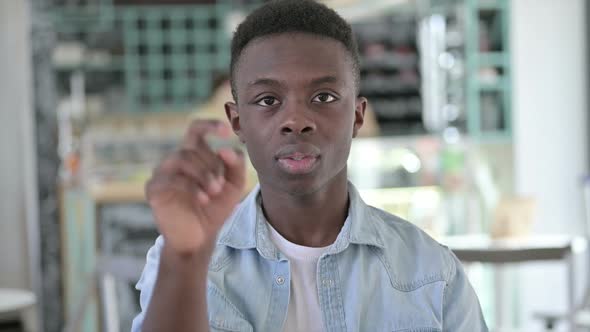 Handsome African Man Pointing and Inviting