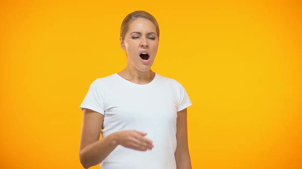 Sleepy Woman in White T-Shirt Yawning, Feeling Bored, Lazy Worker, Tiredness